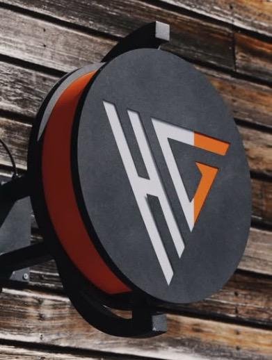 Enseigne ronde au logo HG de Hairitage