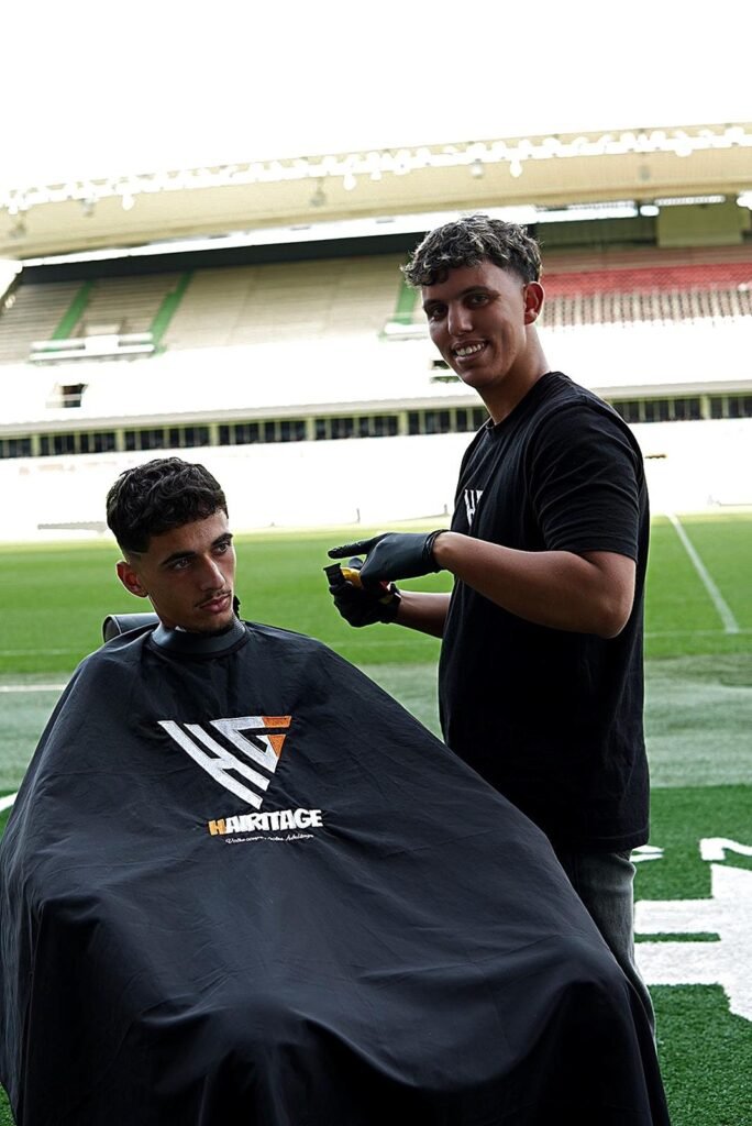 Barbier Hairitage et un joueur sur la pelouse du stade du FC Metz